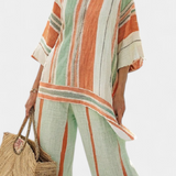 Set Elegante in Lino di Bambù con Righe e Blusa Asimmetrica e Pantaloni Larghi per uno Stile Raffinato