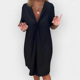 Abito elegante con scollo a V e orlo decorativo