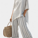 Completo Daisy con Maglietta Asimmetrica e Pantaloni a Righe per uno Stile Moderno ed Elegante